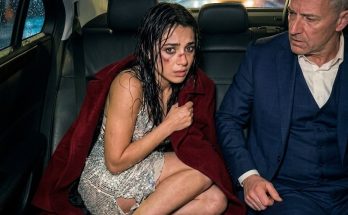 The inside of the car carried the scent of polished leather, cedarwood, costly cologne, and a sterile kind of cleanliness that felt almost unreal after the nightmare Elena had just escaped. Beyond the tinted windows, the world smeared into streaks of gray and black. Rain struck the reinforced glass relentlessly, as though the storm itself was trying to break in. Inside the vehicle, only two things existed: the low, powerful purr of the twelve-cylinder engine and the intimidating presence of the man seated beside her. Matthew Carranza did not turn toward her. His eyes remained fixed on the road, his profile outlined by the dashboard’s dim blue light. Everything about him seemed carved from something unyielding—his sharp jaw, rain-darkened hair swept back from his face, and eyes that carried the cold authority of a man used to commanding empires. Without a word, he picked up a slim black satellite phone. He didn’t bother dialing. One press of a speed-dial button was enough. “Marcus,” Matthew said, his voice low but heavy enough to make the air inside the car feel tighter. “Route 9 and Blackwood Lane. A woman is standing in the road. Patricia Salgado. She’s holding a leather belt. Remove her from the scene. If she tries calling the police, remind her about the pending audit on her logistics company. If she contacts Becerra, tell him he has twenty-four hours to liquidate his assets before I liquidate him.” Elena’s breath caught in her throat. She hugged her knees closer, her bare feet pressing into the flawless leather seat. He knew them. The thought struck her with terrifying force. She had not climbed into the car of some random stranger. She had entered the world of a man who spoke about her abusers as if they were small problems to be erased from his path. Matthew ended the call with a quick movement of his thumb. Only then did he look at her. His dark gaze moved over her with sharp precision, taking in every detail—the soaked, ruined fabric of her cheap dress, the mud smeared along her legs, and the deep purple bruise spreading across her cheekbone. Something dangerous flickered in his eyes. It was not pity. It was colder than that. Older. Angrier. “Who are you?” he asked. “Elena,” she whispered, her voice breaking. “Elena Vargas.” “Elena,” he repeated slowly, as if weighing the name. “Arthur Vargas’s daughter.” It was not a question. Elena trembled and nodded. Her father had died two years earlier, leaving his modest shipping company under the control of his second wife, Patricia. From that moment on, Elena had stopped being treated like a daughter. She had become a captive, a pawn, something Patricia could use to pay off the gambling debts that kept growing around her. Tonight, Patricia’s chosen buyer had been Oscar Becerra—a wealthy, infamous man with a cruel reputation. “I didn’t want this,” Elena said, choking on the words as tears finally broke through her numbness. They burned against her bruised skin. “She locked me in the room. She said if I didn’t… if I didn’t please him, she would sell my father’s house. She hit me. So I ran. I just ran.” Matthew watched her fall apart. He did not offer soft words. He did not comfort her. Instead, he reached into his coat, pulled out a thick wool blanket, and tossed it onto her lap. “Dry yourself,” he said coldly. “It’s a long drive, and I don’t allow blood or tears on my upholstery.” The words were harsh, but the blanket was warm. Elena wrapped it tightly around her shaking shoulders and buried her face into the wool. The car glided faster through the rain, smooth and silent, swallowing the road as Seattle disappeared behind them in a haze of distant lights. The Devil’s Sanctuary Two hours later, the car passed through enormous iron gates that opened by themselves. It climbed a private cliffside road surrounded by tall pine trees swaying in the storm. At the top stood a massive modern estate made of glass, steel, and dark stone, overlooking the restless black waters of Puget Sound. The car stopped beneath a covered entrance. A tall, silent driver in a dark suit immediately opened Matthew’s door and held out an umbrella. Matthew stepped out without waiting for Elena.