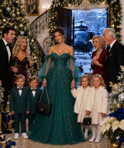 PART 1 – THE NIGHT THE TRUST WAS FROZEN“Mrs. Bennett,” my attorney said calmly, while panic spread through the glittering Christmas room, “the Reynolds family trust has officially been frozen.”

For a moment, no one moved. Soft holiday music still played from hidden speakers, but all I could hear was Marcus Reynolds breathing unevenly as he stared at me like I had become a stranger. Once, I had been his wife. Then I became his secret. Then his shame. Now I was his consequence.

Ashley stood beside him in a red dress, her diamond ring flashing under the lights. That ring alone could have fed my children for months. Marcus lowered the birth certificates onto the table as if they burned his hands.

“Kesha, you don’t understand what you’re doing.”

“For the first time in years, Marcus, I understand perfectly.”

His mother, Patricia Reynolds, stepped forward with her pearls tight around her throat and her eyes cold enough to freeze the room.

“You cannot come into my house and threaten my family.”

I looked at the giant tree, the silver garland, the wrapped gifts, the waiters holding champagne trays, and then at my four children standing beside me in winter coats. Olivia held Ethan’s hand. Caleb tried to look brave. Noah leaned against my leg, too young to understand why the rich man in front of him looked like a ghost.

“Your family?”

My attorney, David Cross, opened his briefcase.

“My client has filed petitions for unpaid child support, hidden assets, fraud, and misrepresentation of marital status.”

Ashley turned sharply to Marcus.

“Marital status?”

Marcus closed his eyes. I answered before he could lie.

“It means Marcus married me first.”

The room exploded into whispers. A glass slipped from someone’s hand and shattered on the marble floor. Marcus muttered that it was complicated, but Ashley’s face changed.

“Were you still married to her when you proposed to me?”

Marcus said nothing. That silence answered for him.

For years, I thought I would hate Ashley if I ever stood in front of her. But when I saw the truth drain from her face, I understood Marcus had not only lied to me. He had built an entire life out of lies and invited everyone to live inside it.

Ashley looked at me.

“Did you know about me?”

“Not at first. When I found out, I was pregnant. He told me he was traveling for work, money was tight, and his mother needed help. Then one day, his number stopped working.”

Marcus rubbed his face.

“Kesha, please. Not in front of the children.”

I almost laughed.

“Now you care what they hear?”

Caleb stepped forward, fists tight.

“You left Mama when Noah was a baby.”

Marcus looked at him, and shame finally crossed his face.

“I didn’t know about Noah.”

Caleb’s voice shook.

“You didn’t ask.”

No one spoke after that. Patricia looked away, but I saw fear flicker in her eyes. She had known enough. Maybe not every detail, but enough to know Marcus had left a woman and children behind. To people like Patricia Reynolds, human beings only became real when paperwork made them expensive.

David handed Marcus another set of papers.

“There is an emergency hearing tomorrow morning. Until then, certain accounts and properties are restricted.”

“On Christmas Eve?” Patricia snapped.

“The court makes exceptions for child welfare and frozen assets.”

Ashley slowly removed her ring and placed it on the table. The sound was small, but final.

“Ashley…” Marcus whispered.

“Don’t say my name like it still belongs to you.”

Then the front doors opened. Two officers entered with another court representative. David explained that records and devices listed in the order had to be secured. Patricia gripped a chair, no longer looking like a queen, but a cornered woman.

Marcus turned on me.

“You planned this.”

“Yes.”

I had planned it during double shifts. I had planned it in free legal clinics with Noah asleep in my lap. I had planned it every time Marcus ignored a letter and Patricia’s assistant said there was no comment. Survival had taught me patience sharper than revenge.

PART 2 – THE BINDER THAT EXPOSED PATRICIA
While officers searched the house, David returned with a black leather binder. His expression had changed, and that frightened me because David was never easily shaken.

“Mrs. Bennett, I need to speak with you.”

I sent the children near the Christmas tree, though Caleb kept watching Marcus. David opened the binder. Inside were old bank transfers, reports, letters, and photographs. One picture slid onto the table. It was me, younger and pregnant, standing outside the small apartment Marcus and I once shared. I remembered the day: carrying groceries, swollen and tired, wearing his old gray sweater because none of my coats fit. I had not known anyone was watching.

David turned more pages. Me leaving a clinic. Me walking Caleb to school. Me holding baby Noah on a bus. The dates stretched across years.

“They were watching us,” I whispered.

Marcus said nothing.

I turned to him.

“You knew where we were.”

“Kesha, listen—”

“You knew where your children were.”

He looked toward the hallway, toward his mother, like a boy still waiting for permission.

David’s jaw tightened.

“There were payments to a private investigator. Reports were sent to Patricia Reynolds.”

Ashley stared at Marcus.

“Your mother had them followed?”

Marcus whispered, “She said it was necessary.”

Necessary. My children’s hunger had been necessary. Their questions, my fear, my humiliation in clinics and grocery stores, all of it had been necessary so the Reynolds name could stay polished.

Then Ashley found another page.

“What is the Bennett Settlement Account?”

Patricia froze. Bennett was my maiden name, the name my children carried because Marcus had not earned the right to give them his.

David read quickly.

“Kesha, this appears to be an account created in your name. Initial deposit: two million dollars. Additional deposits over six years.”

I stared at Patricia.

“There was money?”

“It was set aside,” she said.

“For who?”

“For the situation.”

“The situation? You mean my children?”

David explained that the money had never been released to me. It had been locked behind layered authorization. Ashley looked sick.

“So while she raised his children alone, you hid money meant for them?”

Patricia snapped.

“I kept her from using those children to destroy this family.”

That was when I finally understood. Marcus had abandoned us, but Patricia had managed the abandonment. She funded it, watched it, organized it, and called it protection.

“David,” I said quietly, “add it to the case.”

Patricia laughed.

“You think a judge will simply hand you Reynolds money?”

“No. I think the judge will follow the paper trail.”

Before she could answer, Olivia’s small voice came from behind me.

“We already belong to Mama.”

The room went still. My children stood under the Christmas lights, tiny and brave. Marcus covered his face. Ashley cried silently. No amount of money could return the years they had spent wondering why they were not enough, but it could build something safer. It could make sure Marcus never mistook my silence for surrender again.

As we left, Marcus followed us to the door.

“I want to see them. I know I don’t deserve it, but I want to try.”

“Then tell that to the judge.”

Ashley appeared behind him, without her ring.

“I’ll be at the hearing tomorrow.”

Later that night, after my children fell asleep together under blankets in our living room, my phone buzzed at 2:13 a.m. An unknown number sent a birth certificate. Not one of my children’s. Another girl. Born three years before Caleb. Mother: Ashley Monroe. Father: Marcus Reynolds.

Then came another message.

“You think you found all his children?”

A third followed.

“Ask Ashley what Patricia made her sign.”

Then four final words appeared.

“She is still alive.”

PART 3 – THE FAMILY THAT HAD TO FACE THE TRUTH
The revelations did not stop. At the next confrontation, Marcus’s father, Charles Reynolds, appeared and saw my children for the first time. He did not look shocked. He looked devastated, as if his blood recognized them before his mind caught up.

“They’re his?” he whispered.

“Yes.”

“All four?”

“All four.”

Charles turned on Marcus.

“What did you do?”

Marcus claimed he did not know, but Charles called him a coward. Then Daniel produced an old email confirming I had been pregnant and that Marcus was almost certainly the father. Patricia had known. She had intercepted proof, fed Marcus’s doubts, and buried my children under the weight of her family’s reputation.

“I protected my son!” she cried.

“No,” Charles said. “You protected the family image.”

Marcus finally realized his mother had lied, but I refused to let him place all the blame on her.

“She helped. She manipulated. But you walked away. You chose pride before she ever needed to push you.”

His face crumpled.

“You’re right.”

It was too late, but it was true.

The legal process moved forward. Marcus agreed not to contest paternity, support, or the children’s place in the trust. Contact would be supervised and guided by therapists. Patricia fought every term and lost. Charles apologized for accepting convenient lies. Ashley gave evidence. Later, hidden letters I had written during pregnancy were found in Patricia’s files, including one begging Marcus to come because four premature babies needed every person who might love them. Marcus read it and broke down. I told him sorry could not travel backward, but sometimes it could guard what came next.

The children learned the truth slowly, in pieces they could survive. Patricia was kept away. Charles began showing up carefully, respectfully, never demanding affection. Marcus wrote letters through the therapist instead of forcing himself into their lives. Noah asked about helicopters. Olivia asked about Christmas cookies. Ethan asked the hardest question.

“Why weren’t we worth checking?”

Marcus answered in writing: “You were worth checking. Your mother was worth believing. I failed because I cared more about being angry than being right.”

That answer did not fix everything, but it removed one stone from the wall.

One year later, Christmas came again, this time in Austin, in a rented farmhouse with no old ghosts in the walls. Patricia was not invited. Charles was officially Grandpa. Ashley came with gingerbread cookies. Marcus was invited only for dinner, and he knocked instead of walking in like he owned the place.

The children had made rules. Sophia handed him a seating chart placing him between Charles and Daniel.

“Accountability section,” she said.

Dinner was loud and imperfect. Noah talked about helicopters. Olivia asked if pancakes were now a Christmas tradition. Ethan beat Marcus at chess and admitted he had “improved slightly as a person.” Later, Sophia stood by the tree with a paper.

“Marcus is allowed to keep visiting. He is not Dad yet. Maybe one day. Maybe not. We decide together.”

Marcus’s eyes filled, but he did not argue. That was how I knew something had changed. Not magically. Not completely. But truly.

I had once thought justice would feel like victory. Instead, it felt like my children sleeping safely under one roof, knowing the truth had finally stopped hiding from them. And for the first time in years, Christmas did not feel like something to survive. It felt like something we were allowed to keep.

