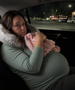 Part 1:I thought pregnancy would be the hardest thing I ever had to survive. I never imagined the loneliest part would begin before my daughter was even born.

Looking back now, I wish I had understood much sooner that something inside my marriage had gone terribly wrong.

The clock on the nightstand glowed 2:47 a.m. I had not slept longer than twenty minutes at a time. My back ached constantly, like someone had shoved a brick beneath my spine, and my baby kept kicking hard beneath my ribs.

I was thirty-four weeks pregnant, and my body no longer felt like it belonged to me.

I rolled to my left side, then my right. I sat up, lay back down, adjusted my pregnancy pillow, and got up to use the bathroom for what felt like the hundredth time. Our apartment was small, one bedroom on the third floor, the kind of place where even quiet footsteps seemed too loud.

Beside me, my husband Ryan let out a dramatic sigh and pulled a pillow over his head.

I remembered the early months, when he rubbed my feet, brought me ginger tea, and laughed that our baby was already bossing us around. That version of him felt like someone I had only imagined.

Since my maternity leave began, Ryan had changed. He complained about the electric bill, my food cravings, my snack wrappers, and most of all, the way I moved around at night.

Two nights earlier, he had snapped,

“You’ve been tossing around for an hour.”

“I’m sorry,” I whispered. “I just can’t get comfortable.”

“Well, figure it out. Some of us have work in the morning.”

I swallowed my answer. My doctor had already warned me that my blood pressure was rising and that lack of sleep could become dangerous. I had not told Ryan. I could already hear his annoyed sigh if I did.

So at 2:55 a.m., I lay perfectly still, staring at the ceiling fan, trying not to breathe too loudly. The baby kicked hard again, and I sucked in a breath.

Ryan shifted beside me. I felt the mattress tighten under him.

“Please,” I whispered to myself. “Please just let me sleep.”

At exactly 3:04 a.m., Ryan suddenly sat up like he had been attacked.

I froze, one hand on my belly and the other gripping the pillow beneath my hip.

“I’m sorry,” I said quickly. “The baby is kicking, and my back—”

He cut me off with a flat, exhausted stare.

“Then sleep somewhere else.”

Before I could answer, he reached toward the counter, grabbed my car keys, and threw them onto the blanket.

“You’ve got reclining seats.”

I stared at him.

“Ryan… I’m eight months pregnant.”

“So?” he muttered, rubbing his eyes. “I pay the rent. I need sleep because I work. You’re on maternity leave. Sleeping in the car for a few weeks won’t kill you.”

There it was.

I pay the rent.

He used those words like a stamp, pressing them over every argument until mine disappeared.

I was too tired and too ashamed to fight. The baby pressed against my ribs, my back screamed, and my throat burned with tears I refused to shed in front of him.

So I said nothing.

I gathered my pregnancy pillow, slipped my swollen feet into flip-flops, and walked out.

Three flights of stairs.

In August.

At three in the morning.

I thought he would apologize the next morning. I imagined him standing in the kitchen, embarrassed, handing me coffee and saying he had been stressed and stupid.

Instead, at 6:34 a.m., my phone buzzed against the dashboard.

You can come back up now.

That was all.

No apology.

No “Are you okay?”

Part 2:
Just permission, like I was a dog he had left outside.

And somehow, that became our routine.

Every night around ten, I carried my pillow down three flights of stairs and climbed into the back seat of my car. I learned which stair creaked, which neighbor left early for work, and how impossible it was to sleep in a Honda Civic with a pregnant belly.

Every morning around 6:30, Ryan texted me when I was allowed back upstairs.

I told no one.

Not my sister.

Not my best friend Kayla.

Not even Dr. Patel at my thirty-six-week appointment, when she frowned at my blood pressure.

“Are you resting, Emma?”

“I’m resting,” I lied.

Her eyes narrowed.

“Emma, I told you sleep deprivation this late in pregnancy is dangerous. For both you and the baby.”

I nodded and reached for my purse, hoping to escape the conversation.

But Dr. Patel did not move.

“If something at home is keeping you from resting, anything at all, you need to tell me. That is what I’m here for.”

For a moment, my throat closed.

Then I looked away and asked about swaddle blankets instead.

At home, Ryan acted as if nothing was wrong. He whistled in the mornings, cooked eggs, kissed my forehead, and pretended his very pregnant wife had not spent the night folded into a car like luggage.

Some nights, lying in the back seat beneath the buzzing parking lot light, I wondered if I was being dramatic. Maybe pregnancy made me emotional. Maybe other women quietly endured things like this and never talked about it.

Then one Friday night, headlights swept across my windshield.

It was just after 2 a.m. when a silver SUV pulled into the parking lot beside me. For a second, I thought it might be security. Then someone knocked three times on the window.

I wiped my eyes and turned.

Standing outside in a bathrobe was my mother-in-law, Dana.

Her hair was flattened on one side, and her face went white the moment she saw me curled in the back seat.

I rolled the window halfway down.

“Dana? What are you doing here?”

“I’ve been texting Ryan all evening about the baby shower,” she said breathlessly. “He wasn’t answering. That isn’t like him. I didn’t want to disturb your rest, but by midnight I was imagining an accident. I couldn’t sleep knowing you’re this far along.”

Then her eyes moved over me, the pillow, the blanket, the cramped back seat.

“Emma… why on earth are you sleeping out here?”

That was when I broke.

I told her everything. The 3 a.m. fight. The keys tossed onto the bed. The comment about reclining seats. The nightly walks down three flights of stairs. The morning texts that let me return.

Dana went completely still.

“He said what?” she whispered.

I nodded, crying too hard to speak.

She looked up toward our dark third-floor window.

“Oh my God,” she said softly. “I can’t believe I raised a son like this.”

I held my pillow tighter.

“Stay here for a few minutes, sweetheart,” she said. “I need to go home quickly. I’ll be back.”

I did not understand, but I nodded.

Fifteen minutes later, Dana returned. She parked, opened the back of her SUV, and pulled out a long package wrapped in brown paper.

“What is that?” I asked.

“A parenting lesson,” she said. “Left over from our lake trip. Come with me. You don’t want to miss this.”

“Dana, it’s the middle of the night.”

“Exactly.”

She helped me out of the car, and my back cracked as I stood. Her face tightened in sympathy.

“Sweetheart,” she said quietly, “you should not be doing this. Not eight months pregnant. Not ever. Not even for one night.”

I looked down, ashamed.

We climbed the stairs together. Dana carried the package like a weapon. I held the railing with one hand and my belly with the other.

Halfway up, I whispered,

“He’s going to be furious.”

“Good.”

“He’ll blame me.”

Dana turned and looked me straight in the eye.

“Emma, listen to me. You have done nothing wrong. You are growing a human being in a body that hurts, and he put you in a car in August heat. Tonight, you stand behind me. I talk. Then you sleep in your own bed. Understood?”

“Yes, ma’am.”

When we reached the apartment, Dana knocked three sharp times.

Ryan opened the door with a sleepy expression, but his face changed when he saw his mother beside me.

“Mom?”

Dana held out the package.

“A little surprise.”

He carried it inside and tore off the paper. Inside was a folded camping cot.

Ryan stared.

“Mom, what the hell?”

“Starting tonight,” Dana said calmly, “you sleep on this in the hallway. Emma sleeps in the bed.”

“You can’t do this!”

“Oh, I can.” Dana’s voice stayed even. “Tell your wife who really pays the rent, Ryan.”

His face went pale.

Dana turned to me gently.

Part 3:
“For two years, honey, I’ve wired money every month to cover most of this apartment’s rent. Ryan’s paycheck does not stretch that far. He just never told you.”

The floor seemed to shift beneath me, but this time in a good way.

Ryan tried to charm her first.

“Come on, Mom. You don’t mean that.”

When that failed, he got angry.

“You can’t order me around in my own place!”

Dana simply unfolded the cot in the hallway.

“The second Emma sleeps in that car again, the transfers stop. Try paying the rent by yourself next month and see how it feels.”

I walked past Ryan with my pregnancy pillow and climbed into our bed.

Our real bed.

The mattress welcomed my aching body like it had been waiting for me.

Ryan slept on that cot for three nights.

On the fourth night, he knocked on the bedroom door, red-eyed and ashamed, and finally apologized.

He agreed to counseling. Dana booked the first session herself.

Six weeks later, I gave birth to a healthy baby girl, with my mother-in-law holding my hand.

After that, I never apologized for taking up space again.

